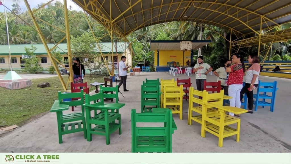 Click A Tree's reforestation project in the Philippines creates school chairs from plastic waste.